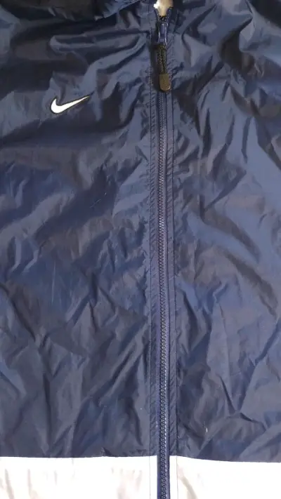 Cortaviento Nike azul marino unisex - miniatura 1