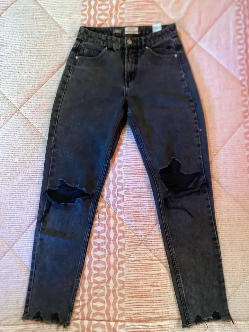 Jeans index negros desgastados para mujer