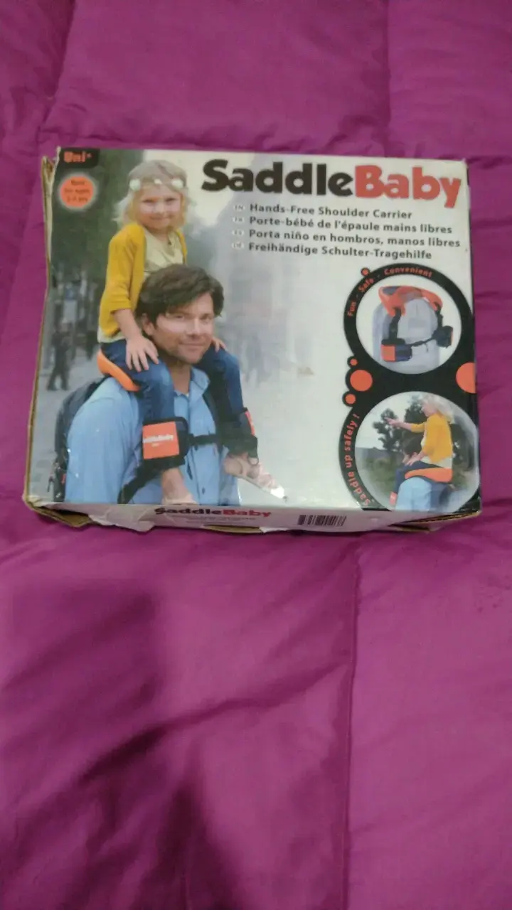 Porta niño SaddleBaby manos libres