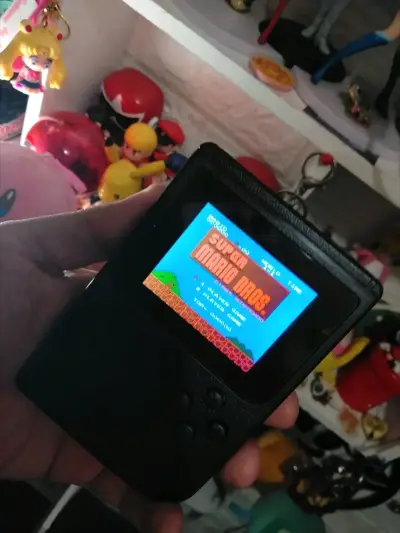 Consola portátil retro con Super Mario Bros - miniatura 1