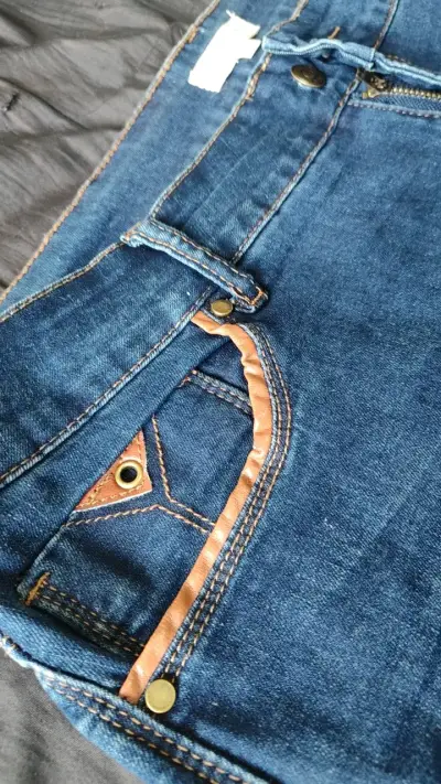 Jeans azules con cordones laterales - miniatura 3