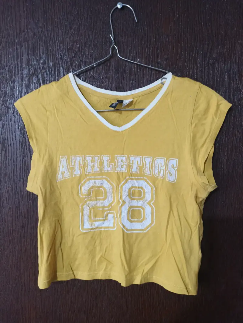Polera amarilla Divide deportiva Athletics 28