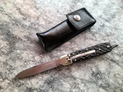 Cuchillo plegable con funda de cuero - miniatura 1