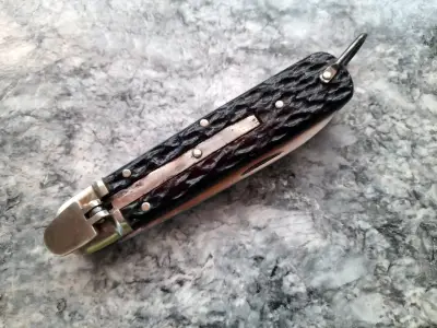 Cuchillo plegable con funda de cuero - miniatura 6