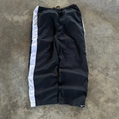 Pantalones deportivos Nike negros con franjas - miniatura 1