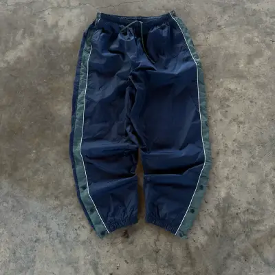 Pantalones deportivos azul con franjas laterales - miniatura 1