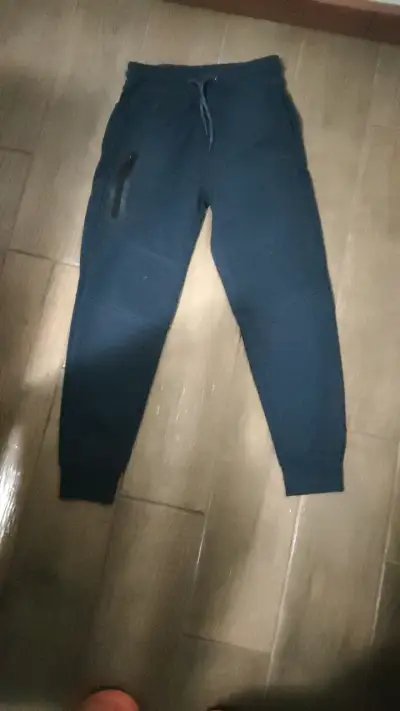 Pantalones deportivos azul oscuro con bolsillo - miniatura 1