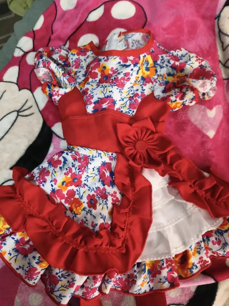 Vestido infantil floral con lazo rojo