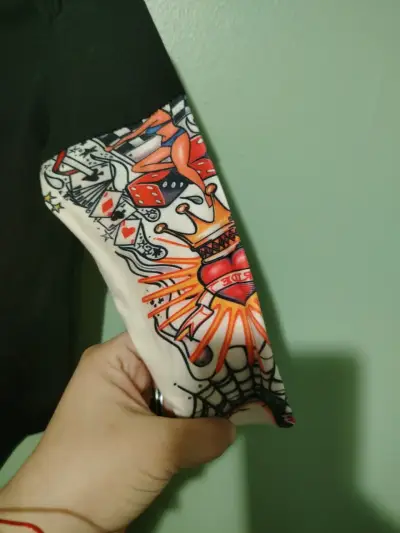 Body de bebé negro con mangas estampadas - miniatura 2
