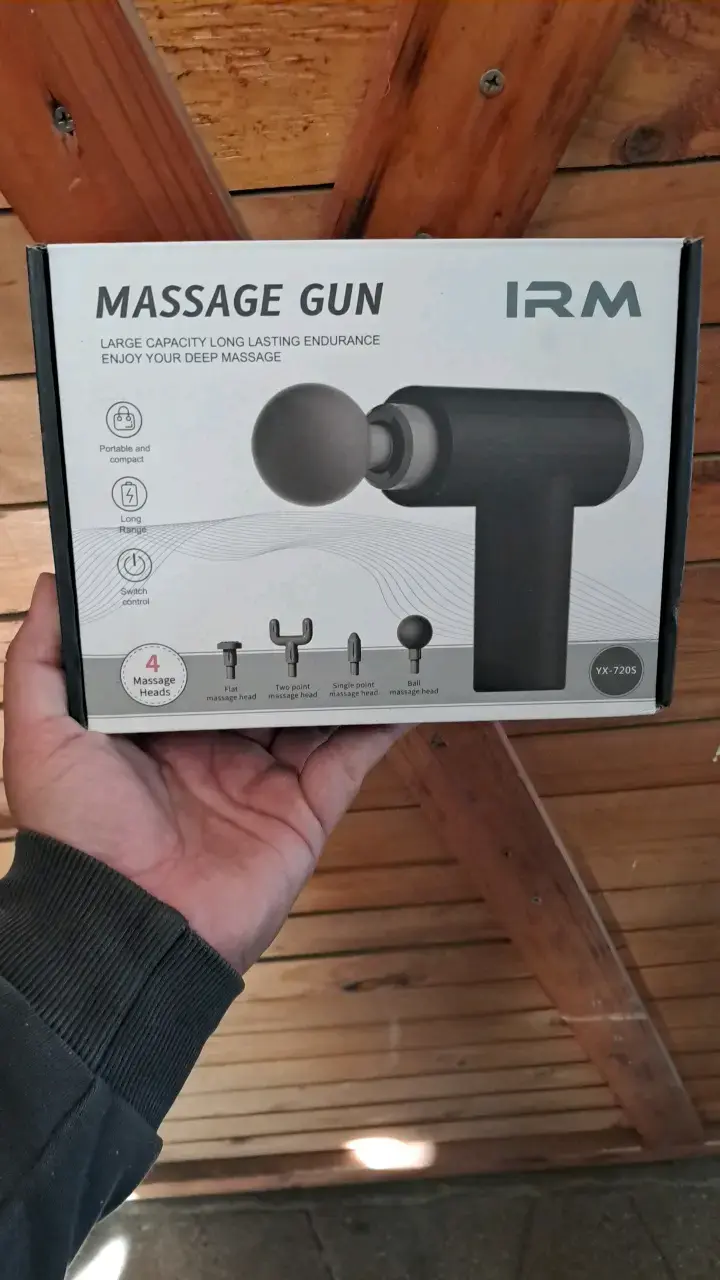 Pistola de masaje con 4 cabezales - 1
