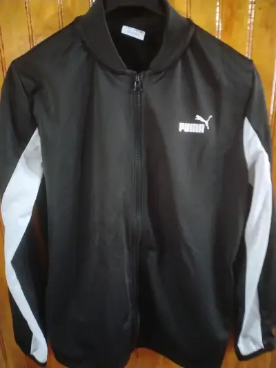 Chaqueta deportiva Puma negra y blanca - miniatura 1
