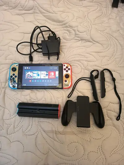 Nintendo Switch con accesorios y cargador - miniatura 1