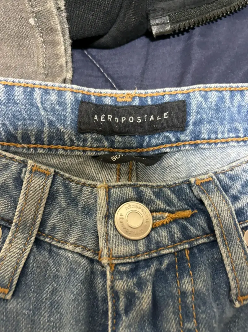Jeans desgastados de mezclilla azul - 2