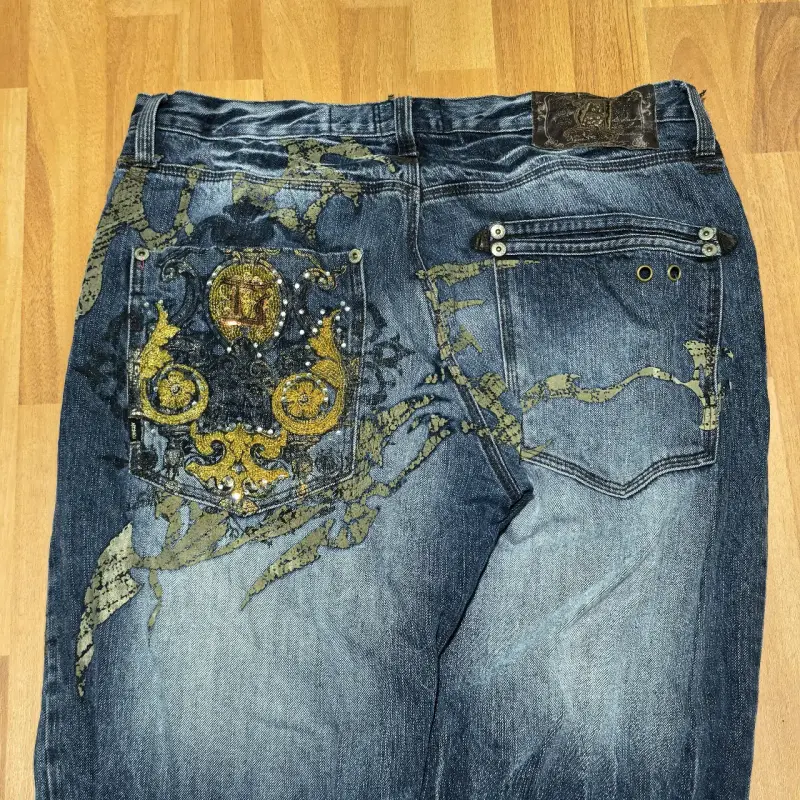 Jeans de diseño con bordado dorado - 1