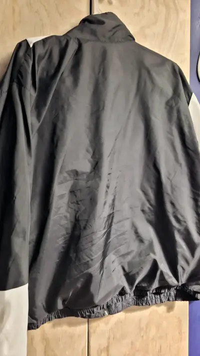 Chaqueta cortaviento negra unisex - miniatura 1