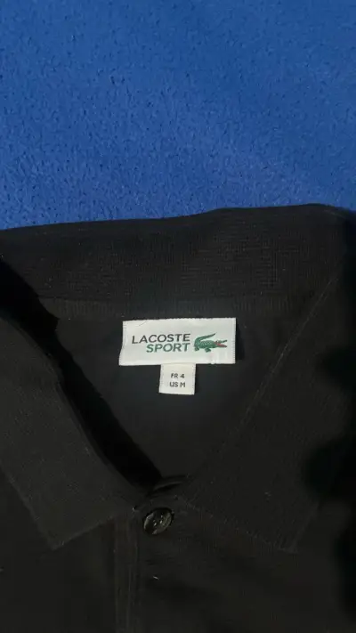 Polera polo negra Lacoste para hombre - miniatura 2