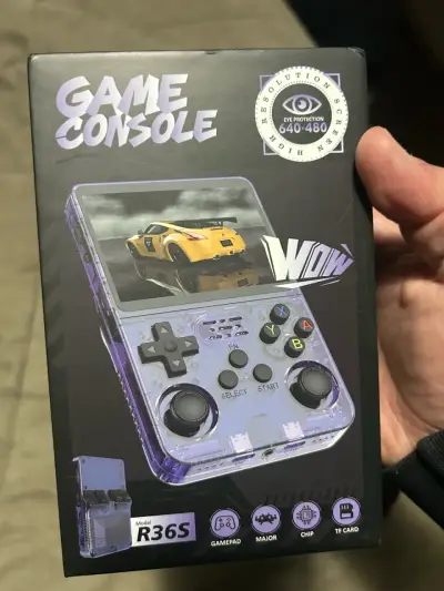 Consola de juegos portátil R36S transparente - miniatura 1