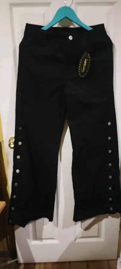 Pantalones negros con botones laterales - miniatura 1