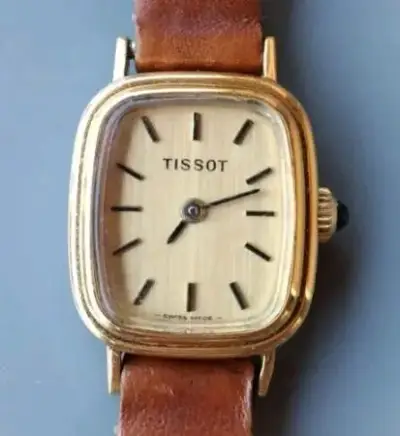 Reloj Tissot vintage dorado con correa de cuero - miniatura 1