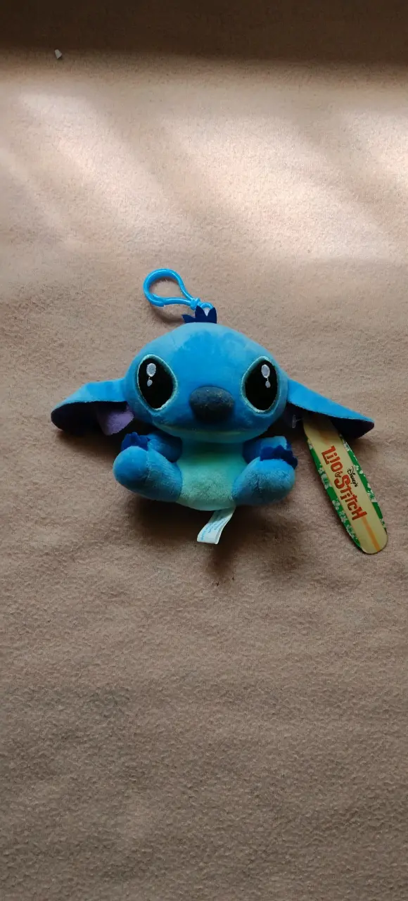 Peluche Stitch Disney con clip azul