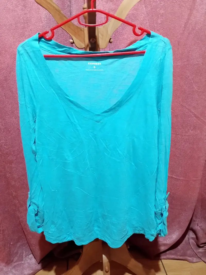 Blusa turquesa Express con lazo