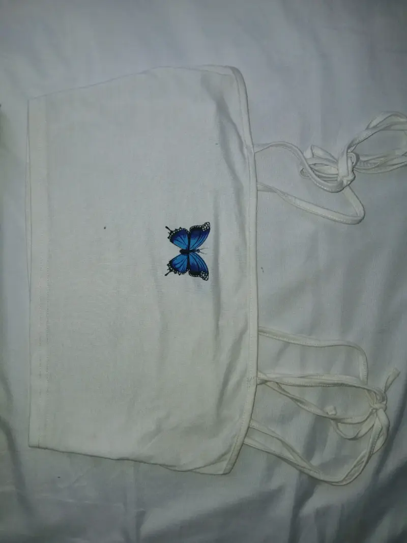 Conjunto top blanco con mariposa y falda a cuadros - 3