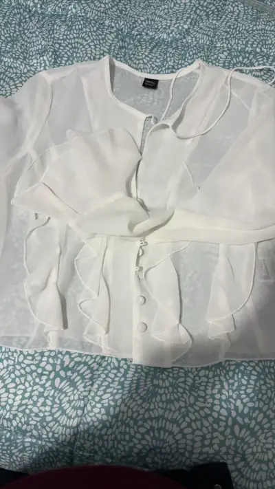 Blusa blanca con volantes transparente - miniatura 1