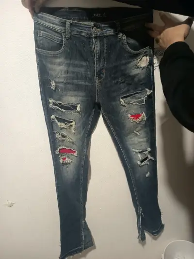 Jeans desgastados con roturas estilo casual - miniatura 1
