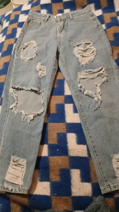 Jeans desgastados de mezclilla azul - miniatura 1
