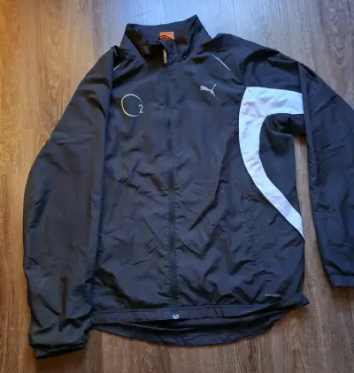 Chaqueta deportiva Puma negra con detalles blancos - miniatura 1