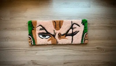 Alfombra tufting con diseño de personaje - miniatura 1