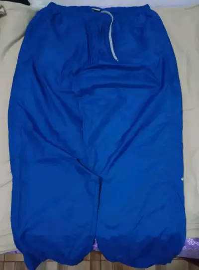 Pantalón cortavientos azul - miniatura 1