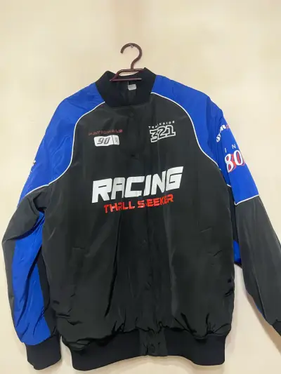 Chaqueta Racing Thrill Seeker negra y azul - miniatura 1