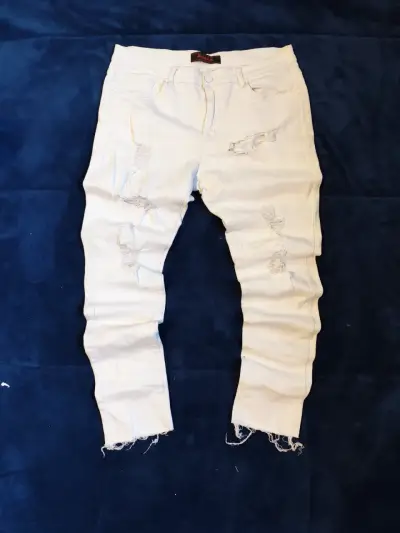 Jeans blancos rasgados para hombre - miniatura 1