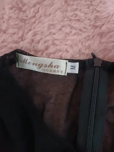 Vestido negro elegante con transparencia - miniatura 3