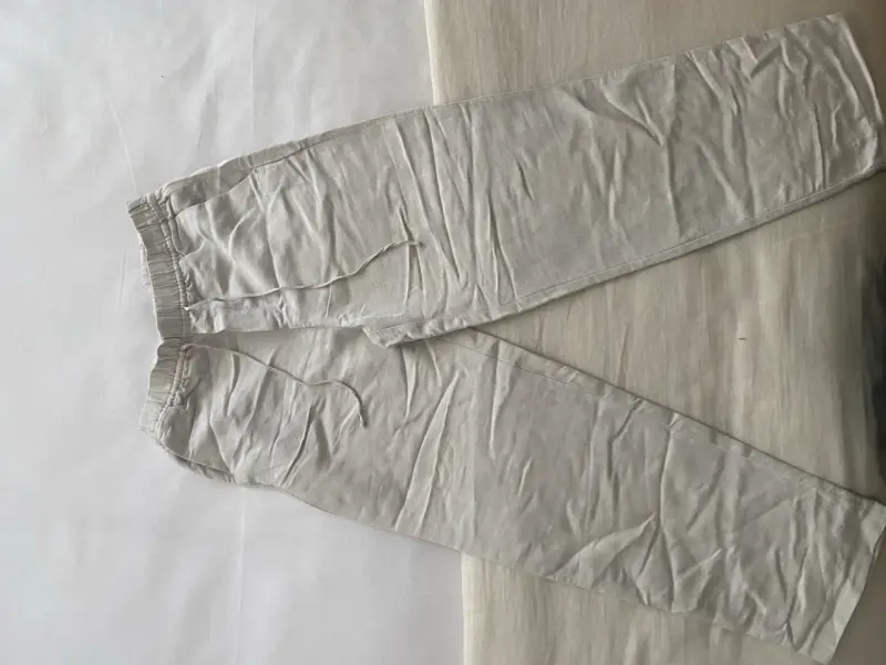 Pantalones de lino beige para mujer