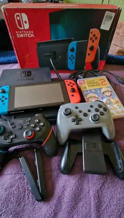 Consola Nintendo Switch con accesorios y juego - miniatura 1