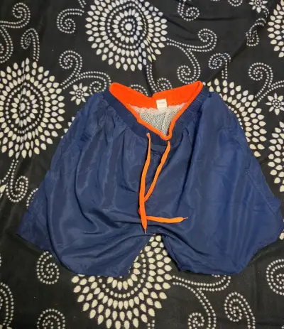 Shorts de baño azul con detalles naranjas - miniatura 1