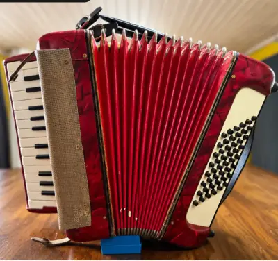 Acordeón rojo vintage en buen estado - miniatura 1