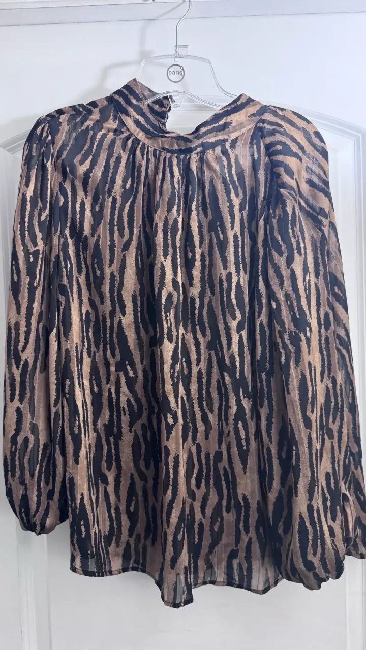 Blusa estampado animal print manga larga