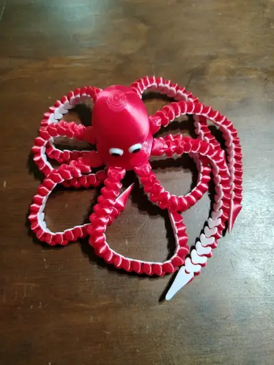 Pulpo de juguete articulado rojo - miniatura 1