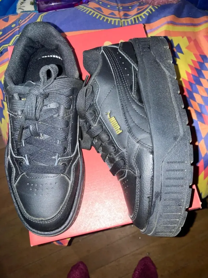 Zapatillas negras Puma deportivas - 1