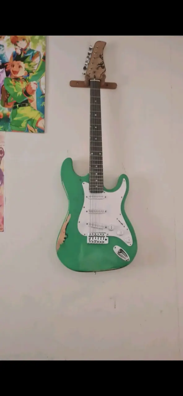 Guitarra eléctrica verde estilo Stratocaster