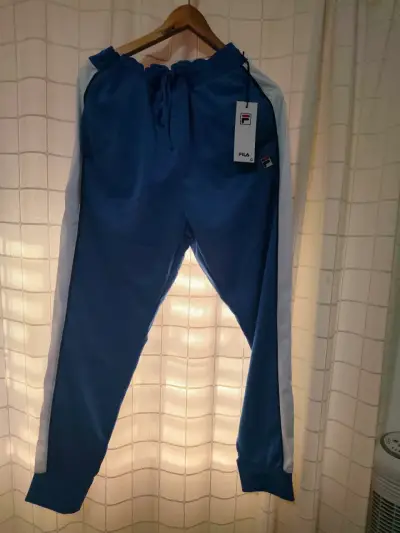 Pantalones deportivos Fila azul con franjas - miniatura 1