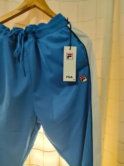 Pantalones deportivos Fila azul con franjas - miniatura 2