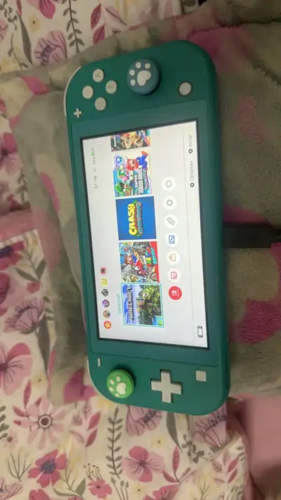 Nintendo Switch Lite turquesa con cargador - miniatura 2