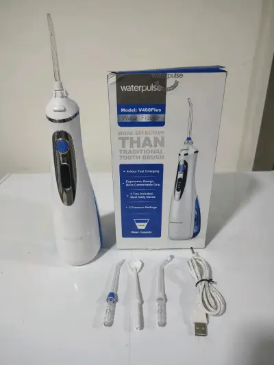 Irrigador dental portátil con accesorios - miniatura 2
