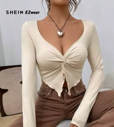 Top beige de manga larga con nudo frontal - miniatura 1