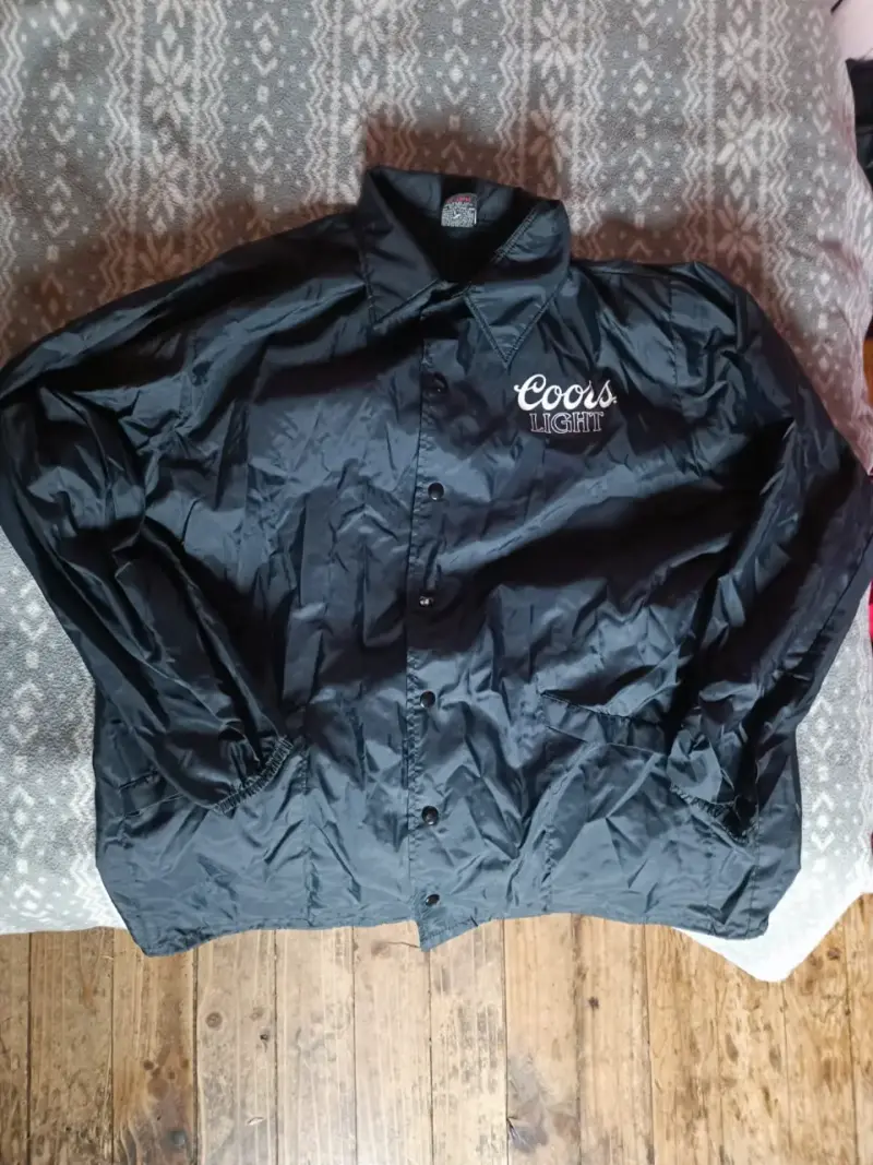 Chaqueta negra Coors Light impermeable