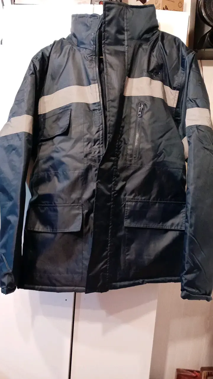 Chaqueta impermeable azul con reflectantes - 1